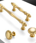 Rad Five Inch Brushed Gold Cabinet Pulls And Drawer Handles built with solid metal shown at various angles on a white surface.