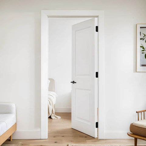 Pro Heavy Duty Self Closing Door Hinges 4 Inch 2 Pack on a white interior door with a black handle.