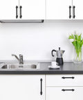 Tough As Nails Matte Black Cabinet Pulls 10 Pack 5 Inch Center To Center Kitchen Drawer Handles in a modern kitchen setting.