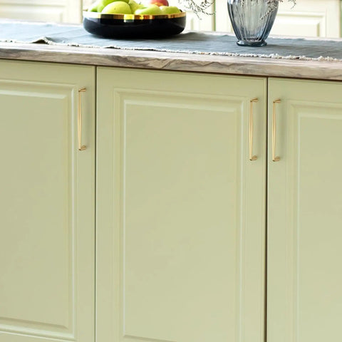 Kickass Brushed Gold Cabinet Handles And Drawer Pulls Made From Solid Zinc Alloy Heavy Duty Build Smooth Finish on kitchen cabinets.