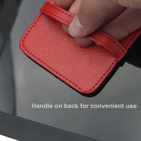 Close-up of hand holding red PU leather handle of 4 Pack Elastic Strap Screen Cleaning Pads With Soft Cloth Wipes For All Screens