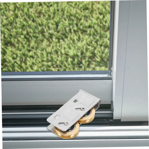 Rock Solid Heavy Duty Double Wheel Sliding Door Pulley Two Pack Stainless Steel Roller Kit on metal track by window.