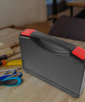 Small Hard Shell Plastic Toolbox Featuring Heavy Duty Multi Compartment Tool Organization And Secure Travel Storage With Hella Tough Durable Construction And Sweet Portable Gear Layouts on wooden surface with tools nearby.