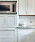 Heavy Duty Brushed Gold Cabinet Pulls And Drawer Handles Zero Hassle Swap Knurled Design 5 Inch Hole Spacing 30 Pack installed in modern kitchen.