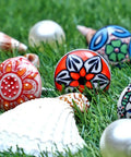 Top Tier Set Of 12 Handmade Ceramic Cabinet Knobs With Hella Smooth Drawer Pulls For Kitchen Bathroom Or Office Heavy Duty Rust Free Furniture Hardware Featuring Bold Multicolor Design displayed on grass with seashells.