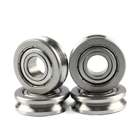 High Precision Miniature Deep Groove Ball Bearing With V Grooved Pulley Wheel For Smooth Zero Drag Guide Roller Movement Featuring Dead Set Carbon Steel Craftsmanship, four units stacked.