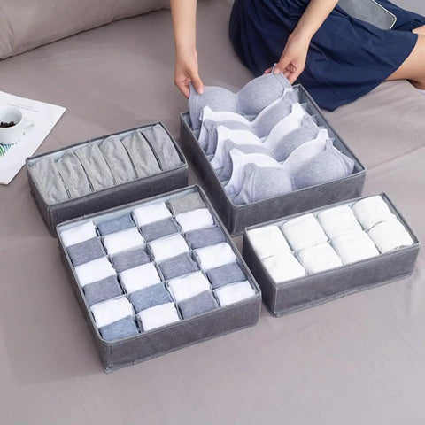 4 Piece Foldable Fabric Drawer Organizer Set For Socks And Underwear Storage Using A Nifty Layout To Keep Your Closet Clean Maximize Dresser Space While Delivering Zero Extra Stress Overall, with gray fabric compartments for organizing bras and socks.
