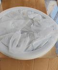 50 Inch White Wooden Lazy Susan Turntable For Kitchen, Smooth As Butter Silent Swivel Serving Tray, wrapped in protective film on a wooden table.
