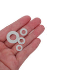 Nylon Flat Washers Assortment Kit, 500 Pack, M2.5 To M8 Sizes, Insulated Spacers For Electrical Projects, Pro Grade, High Temp Resistant, Weatherproof, DIY Wiring And Outlet Safety, white nylon washers in hand