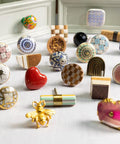 Assorted decorative cabinet knobs featuring various designs and materials on display with Floral Ceramic Cabinet Knobs 4 Piece Set in Yellow.
