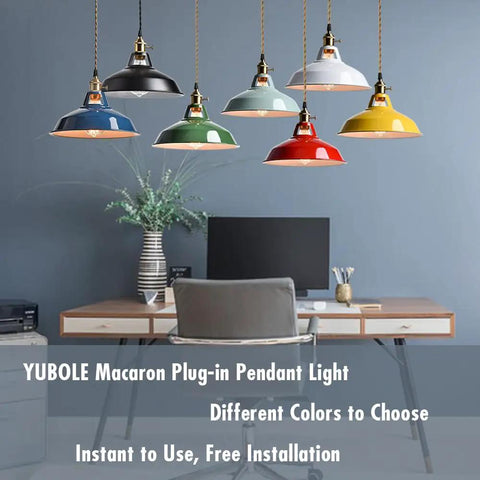 Multicolored pendant lights hanging over a desk setup, showing various color options in an office setting, focus on industrial design.