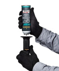 Hands demonstrating the refilling process of a Compact Butane Torch Kit with Adjustable Precision Flame Built In Igniter Spark Ready Solder Tip.