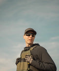 Heavy Duty Tactical Shooting Glasses For Men Featuring Anti Fog Lenses Ansi Z87.1 Certified Ballistic Safety Eyewear worn outdoors.