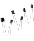 Six Piece Capacitor Repair Set For Bose Wave CD Player with various capacitor sizes and ratings for audio repair.