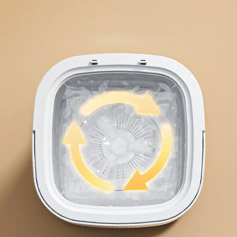 Close-up of Ultra Compact Foldable Portable Washing Machine with Two In One Wash And Dry Combo Function top view of spinning wash drum in action.