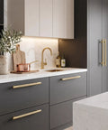 Sophisticated kitchen featuring Top Shelf Knurled Cabinet Pulls 10 Pack In Vintage Gold with six inch centers on modern cabinetry.