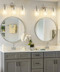 Three Light Bathroom Vanity Light Fixture In Brushed Nickel With Clear Glass Shades Over Mirror Wall Sconce No Fuss Easy To Install