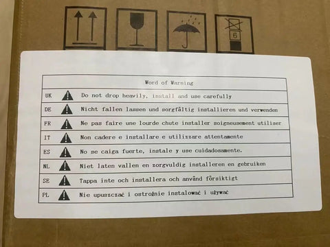 Product warning label in multiple languages for safe installation and handling instructions on package.