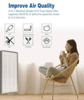Woman sitting with MA 40 Replacement Filter 3 In 1 H13 Main Filter And Activated Carbon for MA 40 Air Purifier, icons displayed