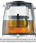 Close-up of Tea Maker Infuser And Water Kettle 51 Oz Capacity With Programmable One Touch Controls And Auto Tea Basket, showing infusion process in brushed stainless steel and glass.