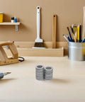 Get Your Garage Ready With These Beefy M10 Manganese Steel Wedge Locking Washers 30 Pairs Set displayed on a worktable.
