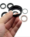 Hand holding a part from Top Shelf Heavy Duty Steering Head Bearing Set For Y Series Electric Scooters Y6s Y8s Complete Ball Bearing Kit.