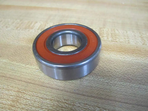 6204 Deep Groove Ball Bearing Featuring 20 mm Bore 47 mm Outer Diameter And 14 mm Width Single Sealed Steel Cage on wooden surface.