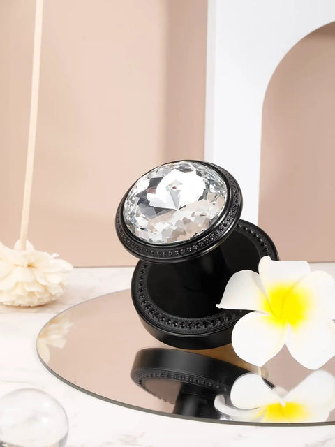 Gold Interior Privacy Glass Door Knob With Lock For Bedroom And Bathroom, black base, crystal knob, on mirrored surface with flower accent