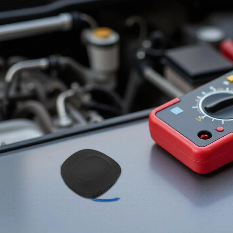 Automatic Fire Suppression System And Vehicle Fire Extinguisher With Self Activating Aerosol Mechanism For Cars Trucks And Vans, compact black sensor on metal surface.