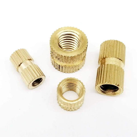 Grab These Awesome Solid Brass Insert Nuts For Your Next DIY Project Featuring Durable Knurl Design For Secure Bolt Threads In Injection Molding And Metal Fixing Work Perfectly For Any Serious Hobbyist Who Needs Reliable Hardware That Sticks Tight And - Set of four brass insert nuts with knurl design.