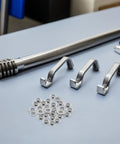 One Hundred Pack Stainless Steel Eyeglass Flat Washers For Glasses Frame Repair Kit displayed with gaskets and tools.