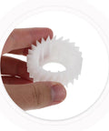 Hand holding Washer Plastic Ratchet Clutch Replacement Part With Precise Torque Control, Heavy-Duty Gear For Easy Installation And Reliable Home Use, Durable Plastic Construction For Long-Lasting Laundry