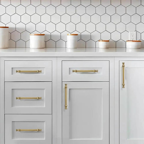 Ten Pack Six Inch Brushed Brass Cabinet Pulls featuring heavy duty solid metal construction on white kitchen cabinets.