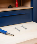 One Hundred M6 Cold Rolled Steel Binding Screws And Cabinet Connectors For Hassle Free Furniture Assembly and Closet Joints on wood surface.