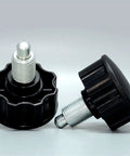 Heavy Duty M20 Indexing Plunger and Spring Loaded Locking Dowel Pin with Bulletproof Screw Grip for Zero Play Precision Alignment plus Rock Solid Industrial Positioning Includes One Full Sized Unit, close-up view of two pins with black plastic grips.