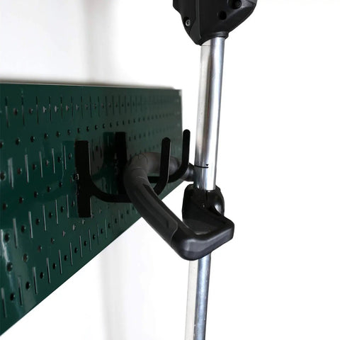 Hella Durable Garage Storage Rack And Lawn Garden Tool Organizer Wall Mount 64 Inch Wide Heavy Duty Metal Pegboard Set Green Panel with steel hooks holding tools.