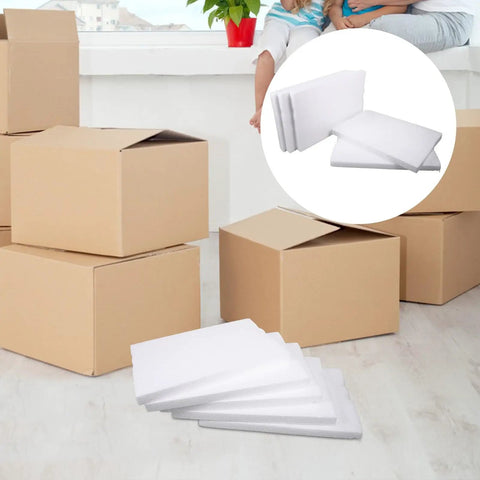 Heavy Duty White Foam Board Panels For Tight Parcel Wrapping And Rock Solid Packing Supplies arranged near cardboard boxes.