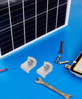 Rock Solid Heavy Duty Aluminum Solar Panel Clamps 12 Piece Set with M8x25 Hex Screws on a blue workbench.