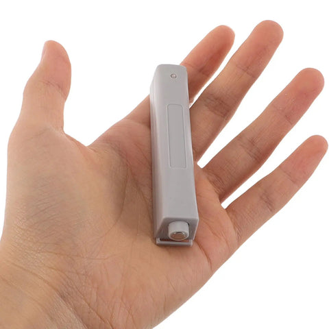 Push To Open Cabinet Hardware 4 Pack Plastic Touch Latch held in hand
