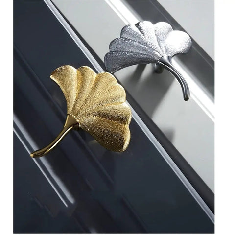 Premium Brass Cabinet Handle With Top Notch Drawer Pull And Slick Nordic Finish Solid Corrosion Resistant Build No Fuss Easy Install Hardware For Dresser And Wardrobe Doors, featuring gold and silver leaf designs.