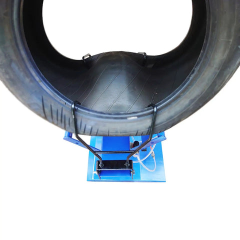 Solid Build Pneumatic Tire Changer And Tire Spreader For Compact Cars And Motorcycles Heavy Steel Construction showing tire mounted on tool.