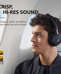Man wearing Space One Active Noise Cancelling Headphones With 40 Hour Battery LDAC Hi Res Wireless Audio Bluetooth 5.3 on airplane