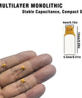 600 Piece Ceramic Capacitor Assortment Kit With 15 Essential Values From 10pF To 100nF showing multilayer monolithic capacitors in hand.