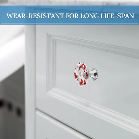Round Cabinet Knob Set Of Two Featuring Vintage Red Floral Design In Rust Proof Stainless Steel With Screws Included on a drawer.