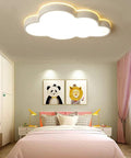 Cloud Shape LED Ceiling Light For Kids Room Acrylic Flush Mount Chandelier with dimmable white light over a kids bedroom.