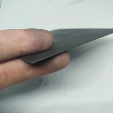 Close-up of high temperature graphite plate 100x50x2mm for pyrolysis block, anode anti-corrosion heat sink, demonstrates low porosity surface