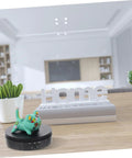 Slick Automatic Jewelry Display Stand That Goes Hard With A Smooth Rotating Motorized Turntable Platform For Watches And Accessories Heavy Duty Retail Ready Real Deal Premium Abs Finish with a decorative toy on a black platform.