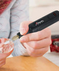 Mini Cordless Rotary Tool Kit Featuring Killer Performance At 15000 Rpm in use, detailing a crystal. Cordless, compact design.