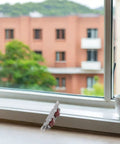 Heavy Duty Stainless Steel Sliding Window Roller Set Featuring Dual Wheels Built Tough, installed in window frame, showing smooth glide design.