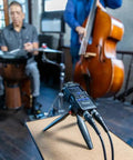 ProGrade 32Bit Float Recording Rig With Two LongReach Xlr Lines set on a table, recording musicians in a studio setting.